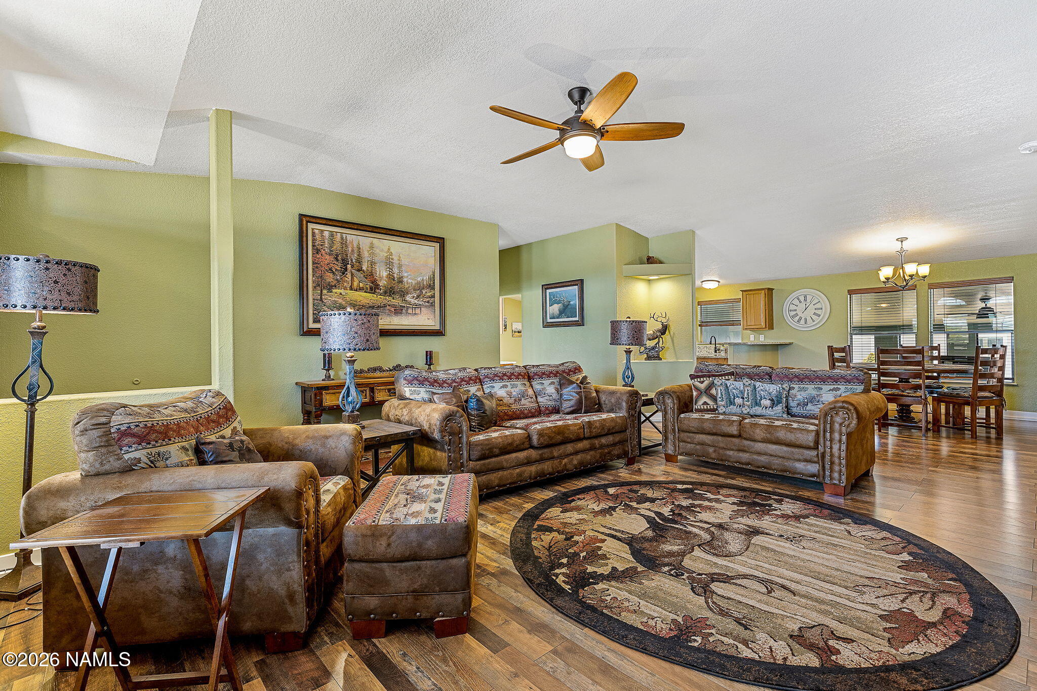 2318 Hoctor Road Williams, AZ 86046 - Photo 7 of 36 a living room with furniture and a chandelier