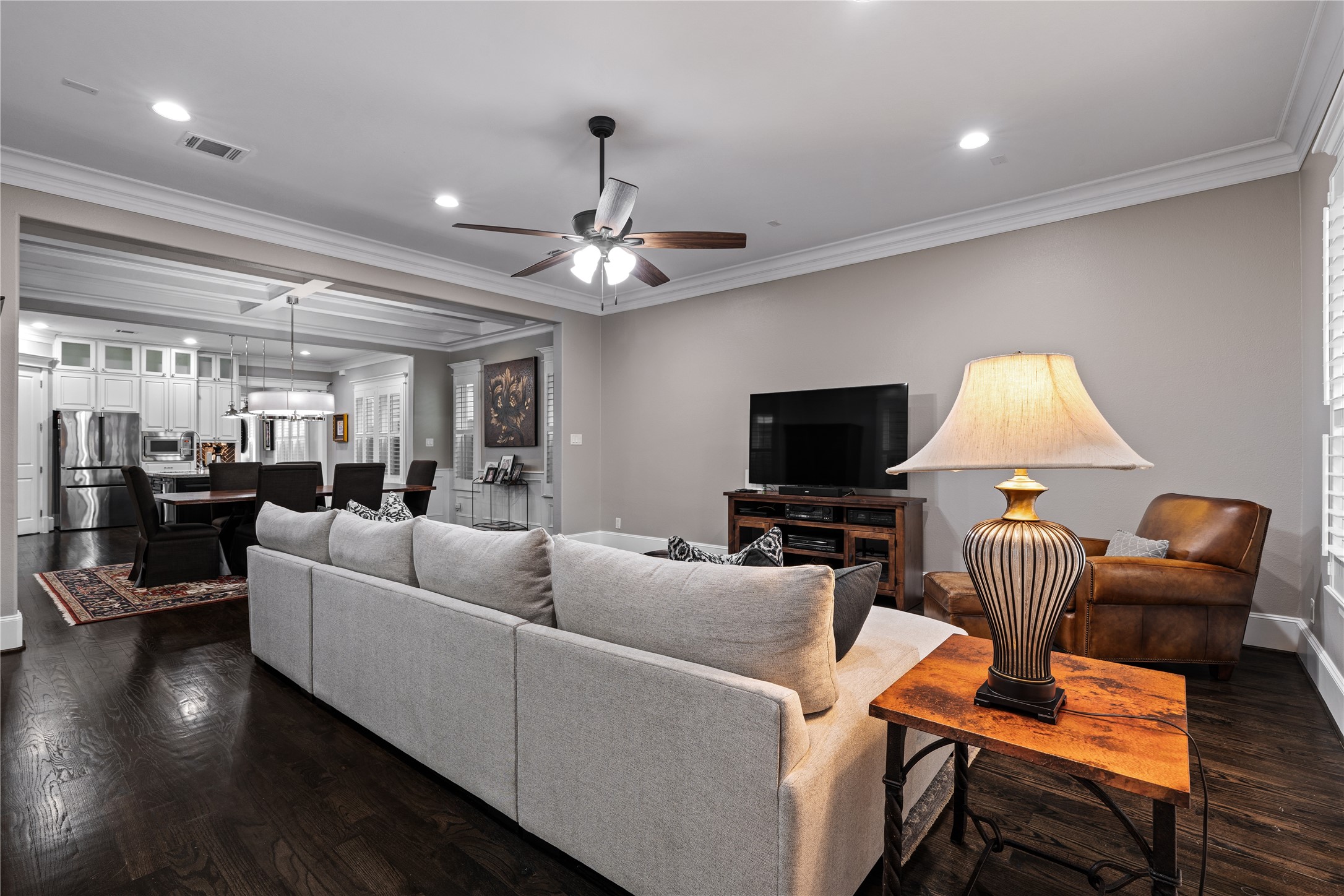 422 West 26th Street Houston, TX 77008 - Photo 16 of 39 The expansive living room offers a massive footprint for gatherings, featuring high ceilings, a new ceiling fan, and views of the private backyard.
