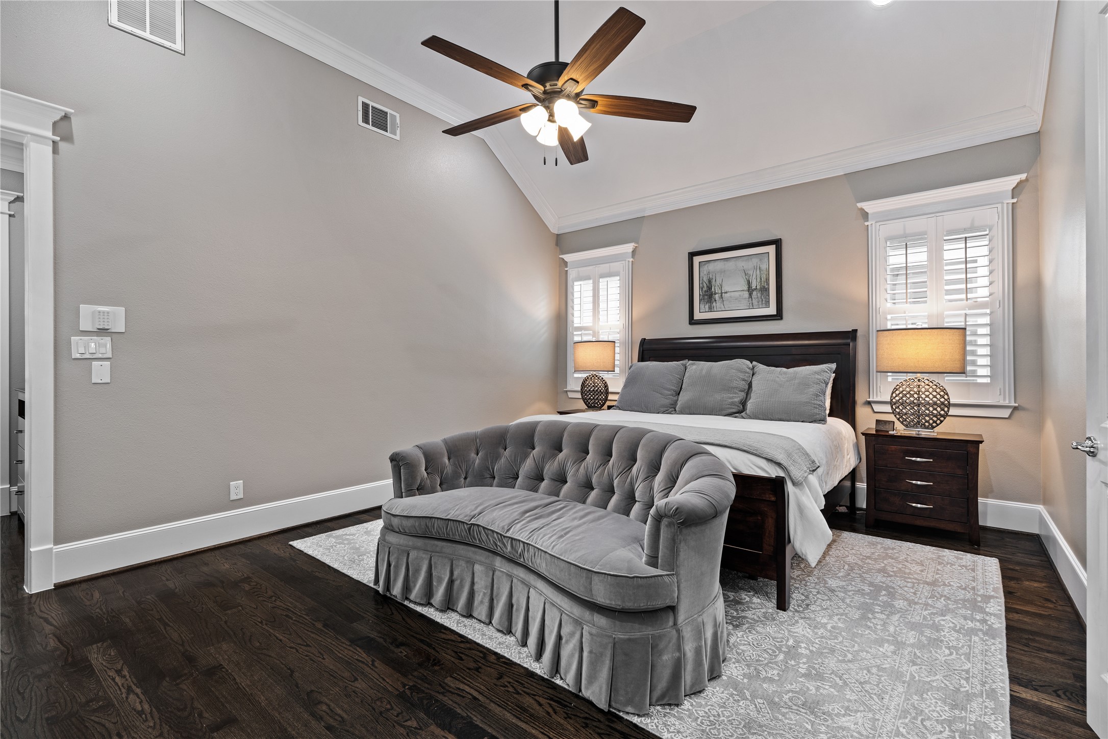 422 West 26th Street Houston, TX 77008 - Photo 20 of 39 Dual windows with plantation shutters flank the primary bed, providing a bright and airy feel to the private second-story retreat.