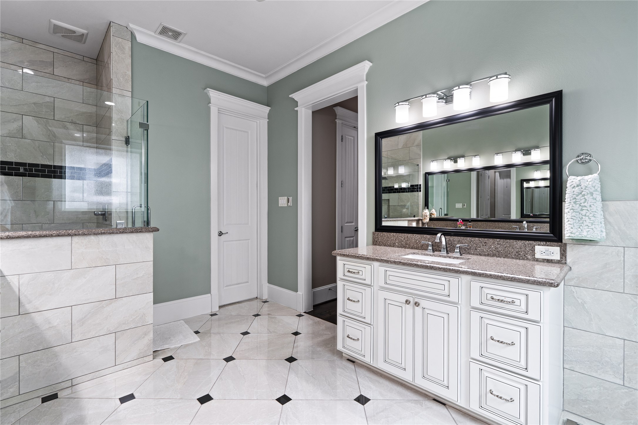 422 West 26th Street Houston, TX 77008 - Photo 24 of 39 This additional vanity view highlights the generous counter space and the elegant plumbing fixtures used throughout the suite.