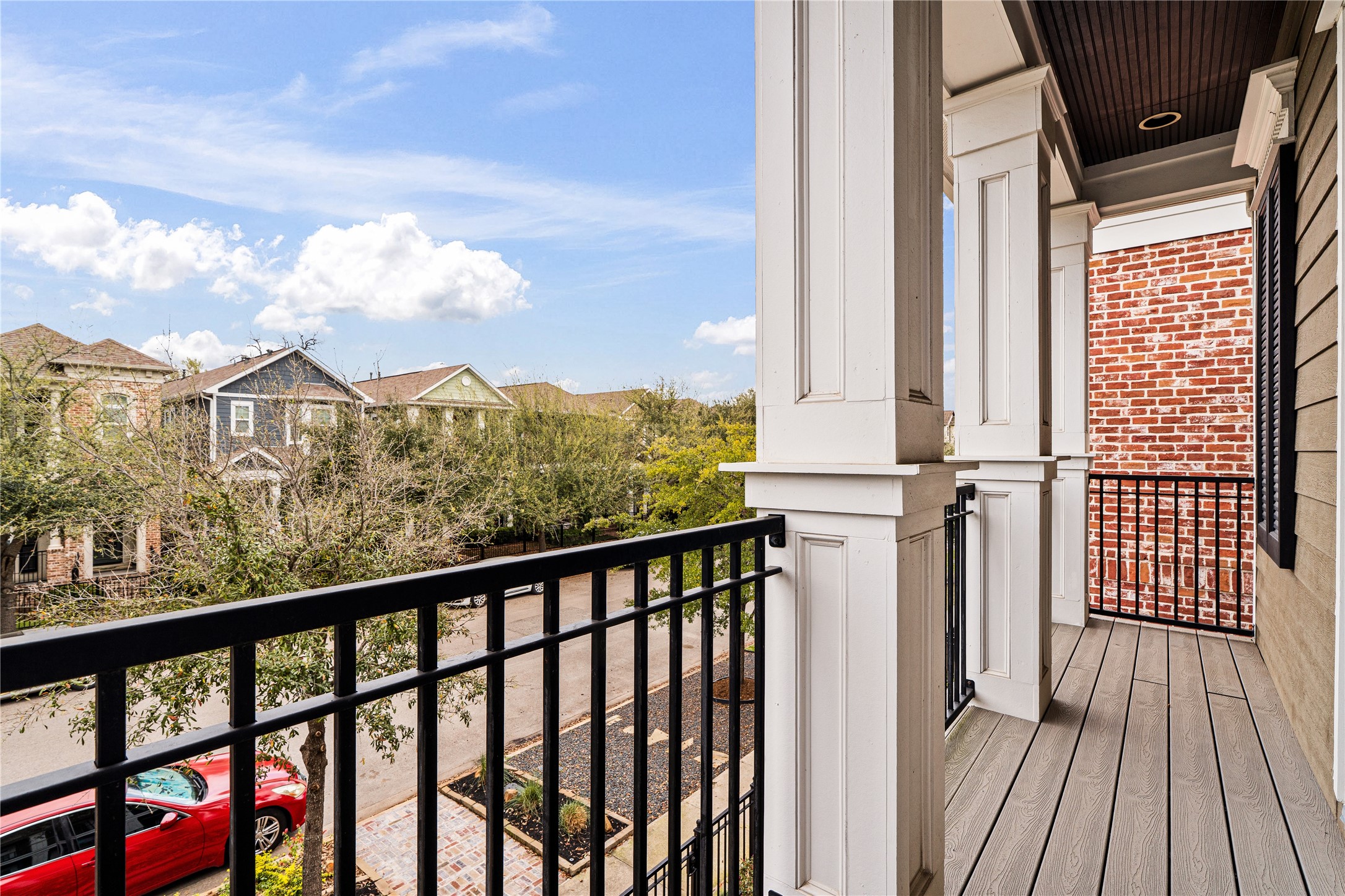 422 West 26th Street Houston, TX 77008 - Photo 33 of 39 Step out onto the private second-story balcony to enjoy elevated views of the wide, tree-lined street and the vibrant Heights neighborhood below.