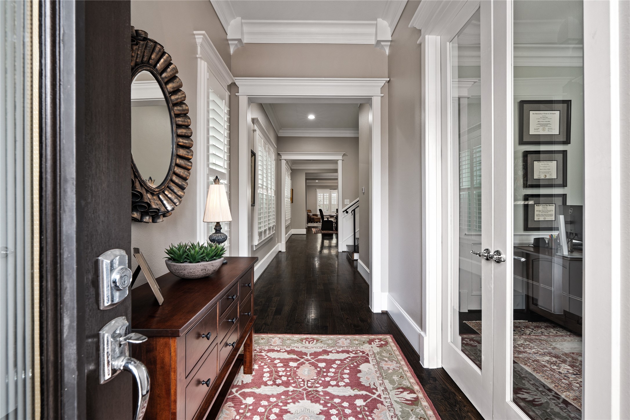 422 West 26th Street Houston, TX 77008 - Photo 6 of 39 Inside, the formal entryway sets an elevated tone with soaring ceilings, hardwood floors, and extensive crown molding.