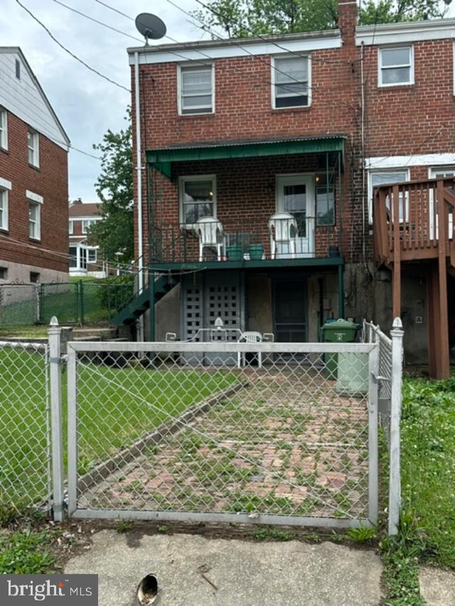 1619 Inverness Avenue Baltimore, MD 21230 - Photo 26 of 30 a front view of a house with garden