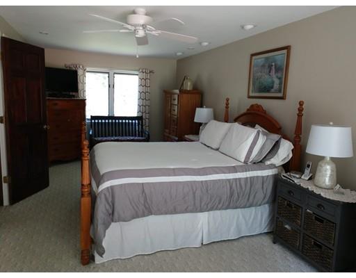 39 Carrington Road Montgomery, MA 01085 - Photo 8 of 23 a bedroom with a bed and wooden floor