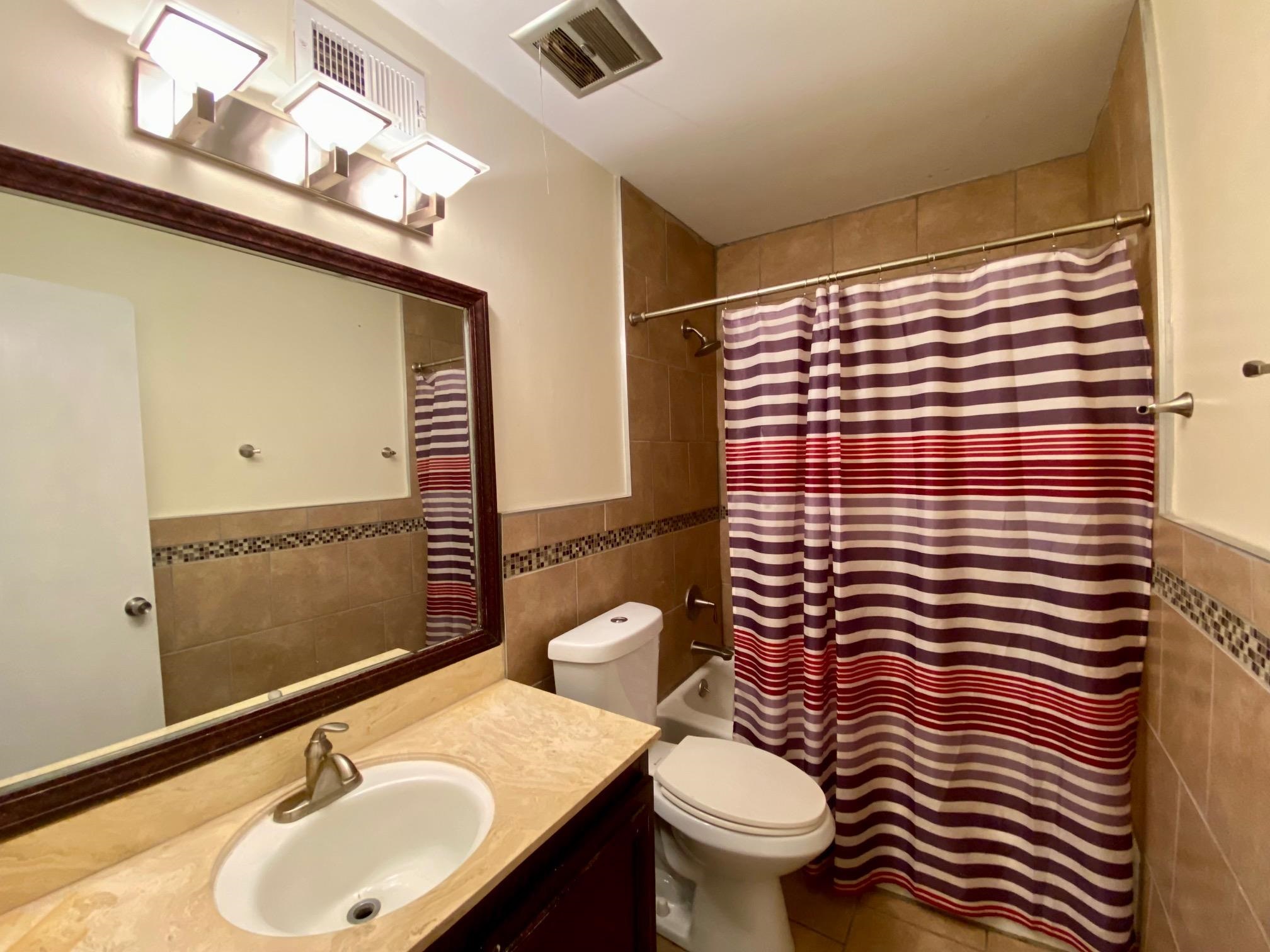 5700 Quince Road, Unit 4 Memphis, TN 38119 - Photo 11 of 16 a bathroom with a sink and a toilet
