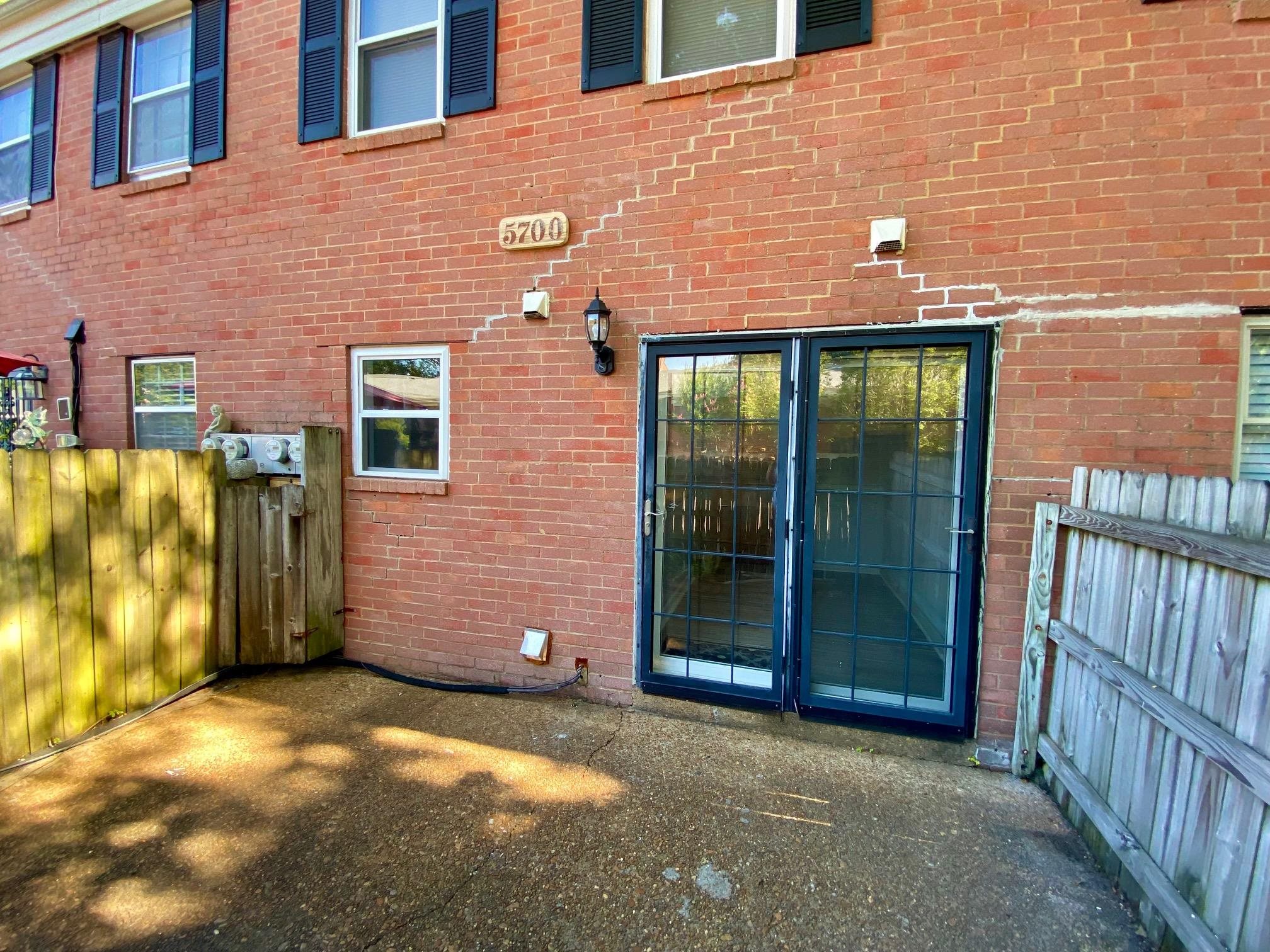 5700 Quince Road, Unit 4 Memphis, TN 38119 - Photo 12 of 16 a view of a brick house with a street