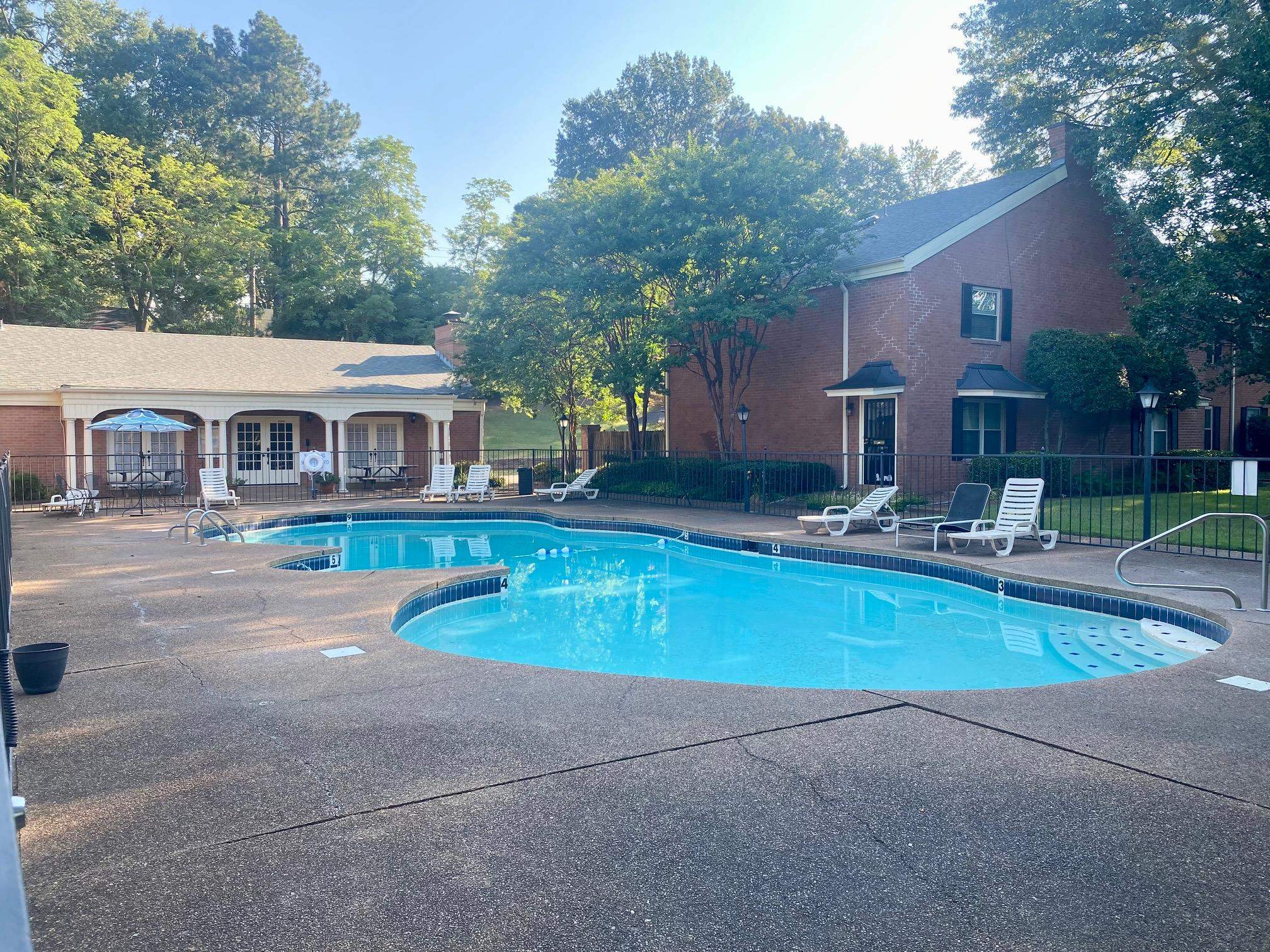 5700 Quince Road, Unit 4 Memphis, TN 38119 - Photo 13 of 16 a view of a house with pool and chairs