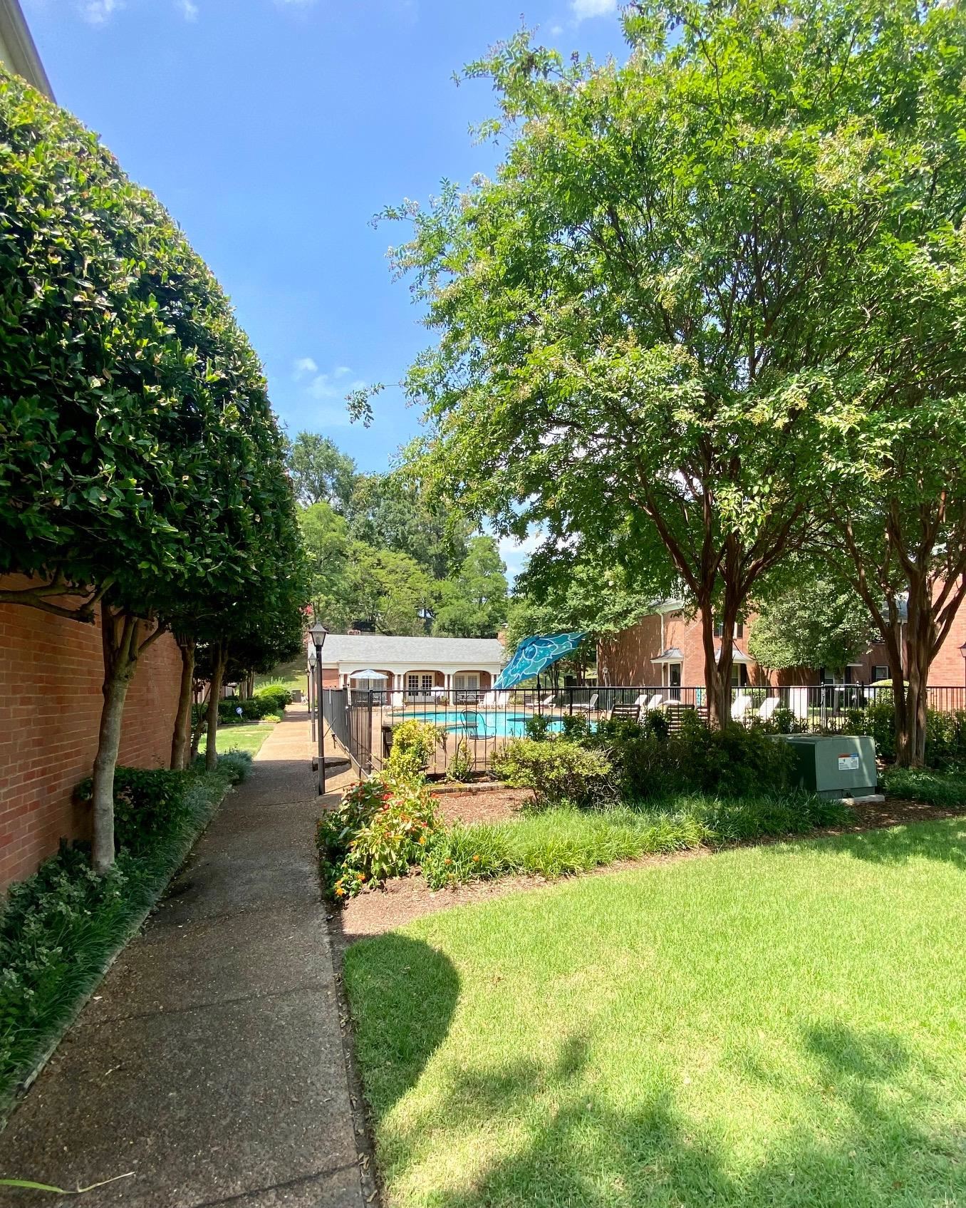 5700 Quince Road, Unit 4 Memphis, TN 38119 - Photo 14 of 16 a view of a house with a yard