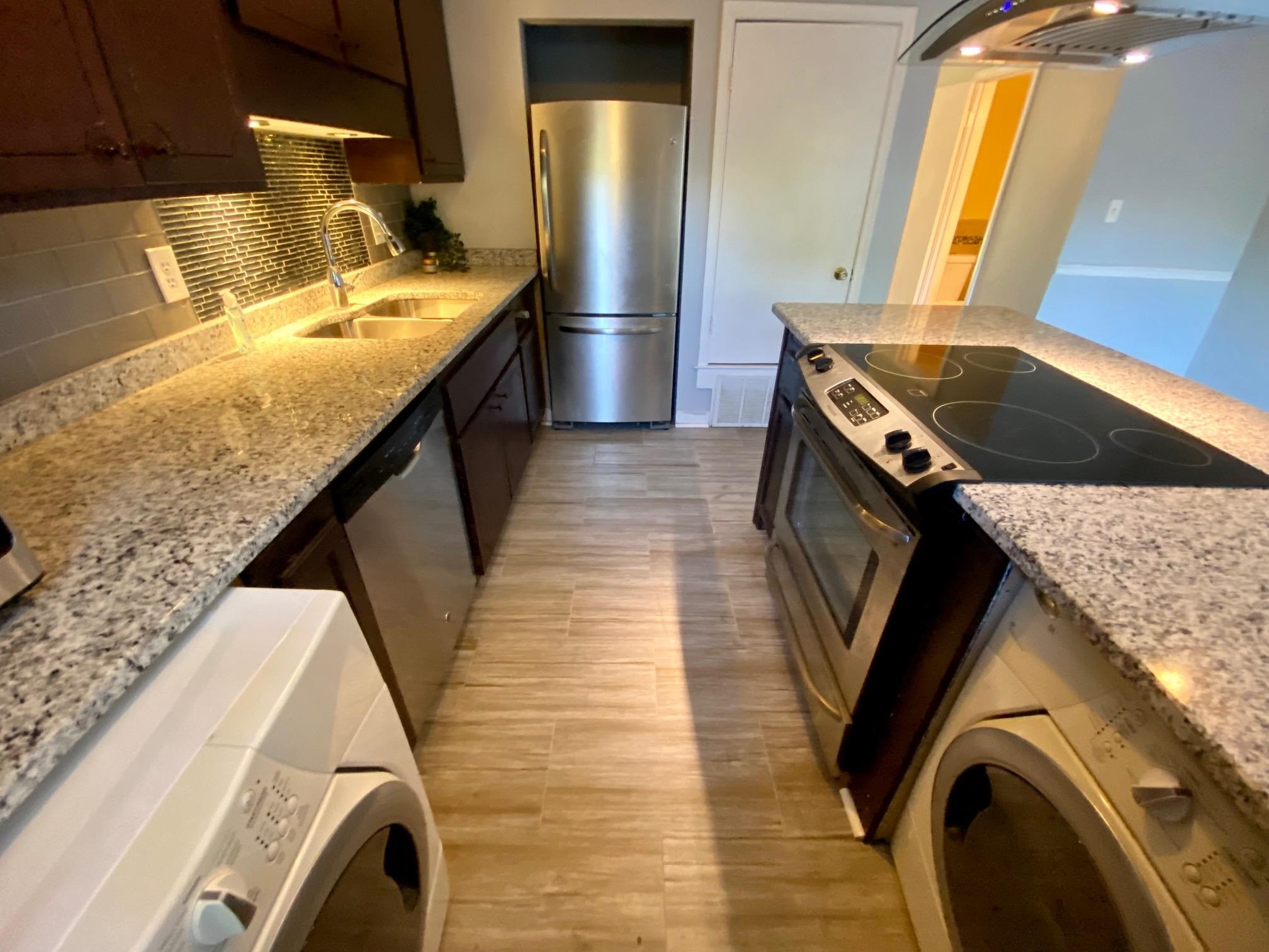 5700 Quince Road, Unit 4 Memphis, TN 38119 - Photo 7 of 16 a kitchen with refrigerator and window