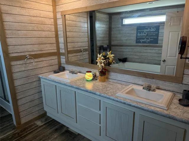 a bathroom with a sink and a mirror