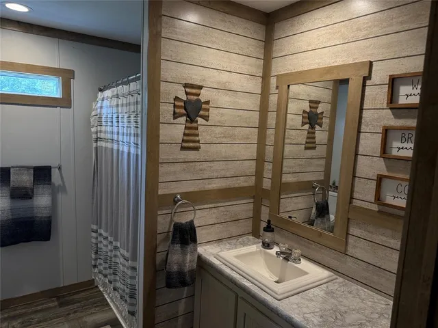 a bathroom with a sink and mirror