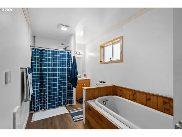a bathroom with a bathtub sink and toilet