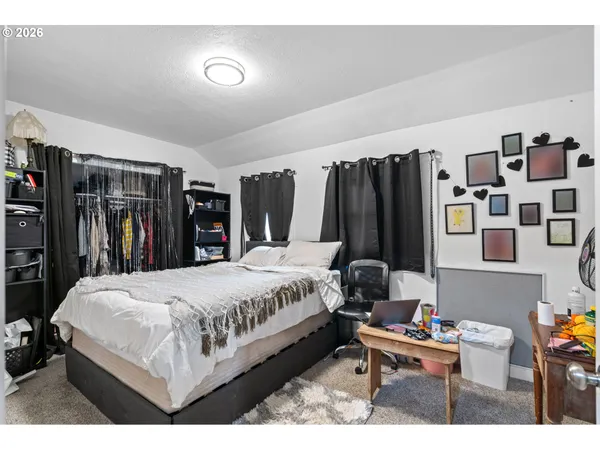 a bedroom with a bed and a closet
