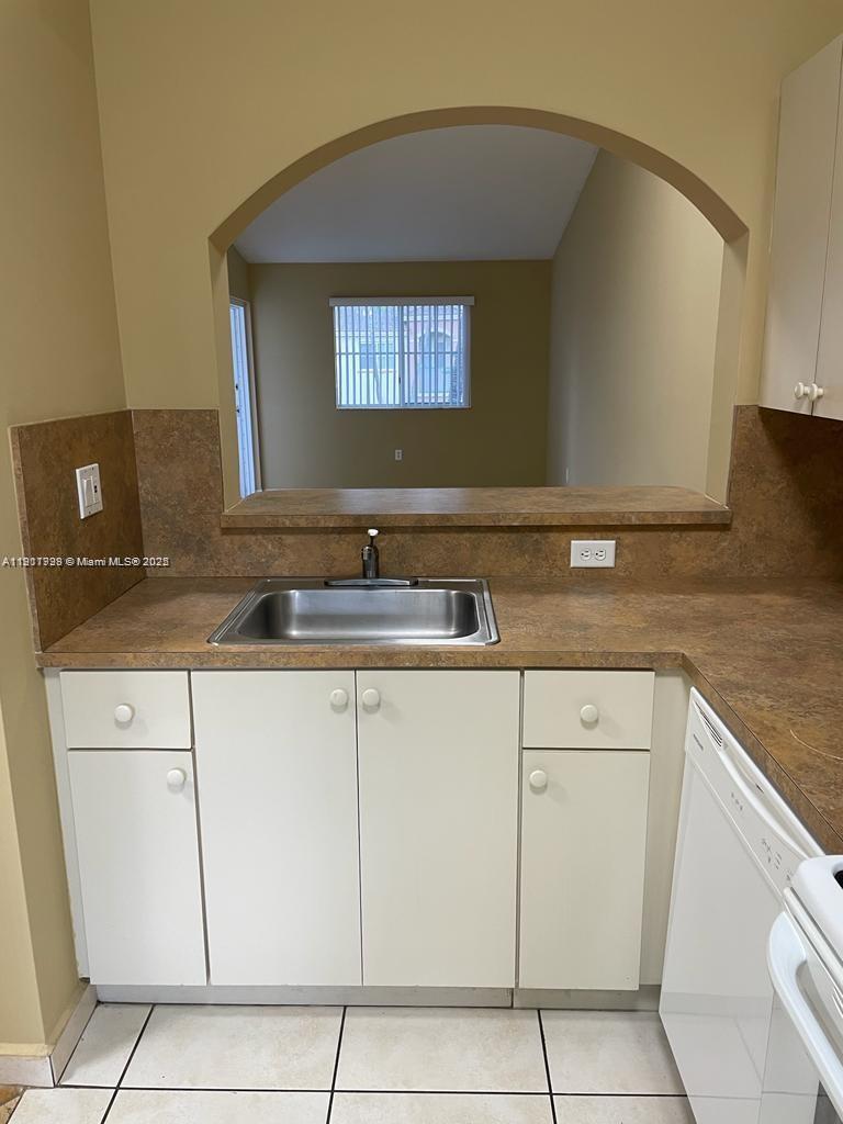 2920 Southeast 13th Road, Unit 20245 Homestead, FL 33035 - Photo 10 of 20 a sink with white cabinets