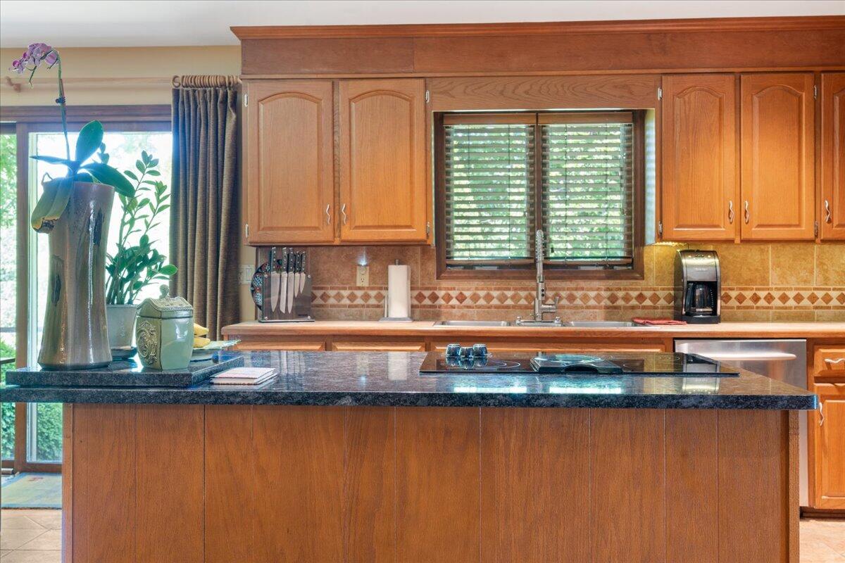 453 Wirtz Road Wirtz, VA 24184 - Photo 18 of 69 a kitchen with granite countertop a window a sink and a counter space