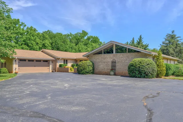 a view of house with outdoor space and porch