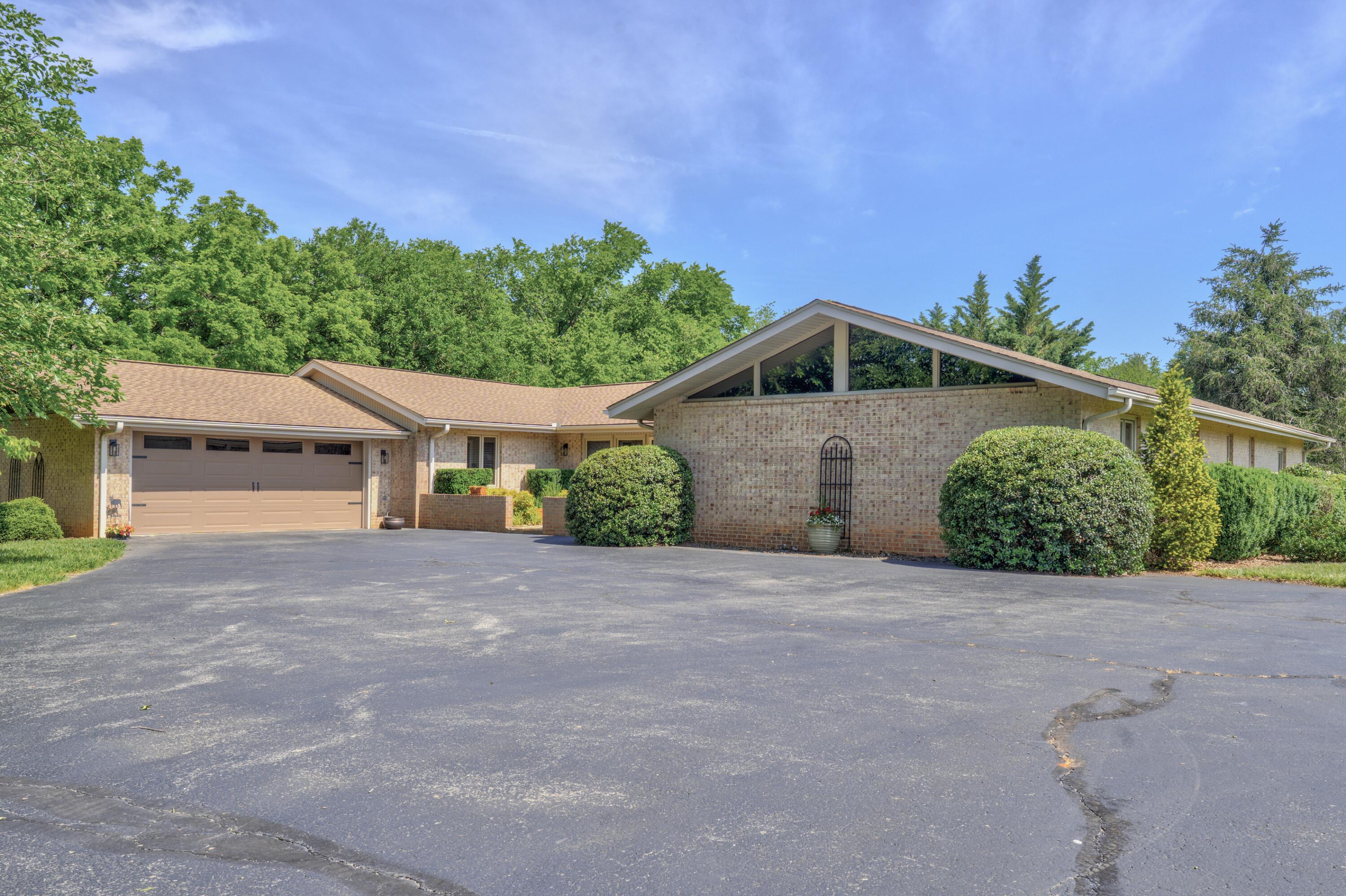 453 Wirtz Road Wirtz, VA 24184 - Photo 2 of 69 a front view of a house with a yard and garage