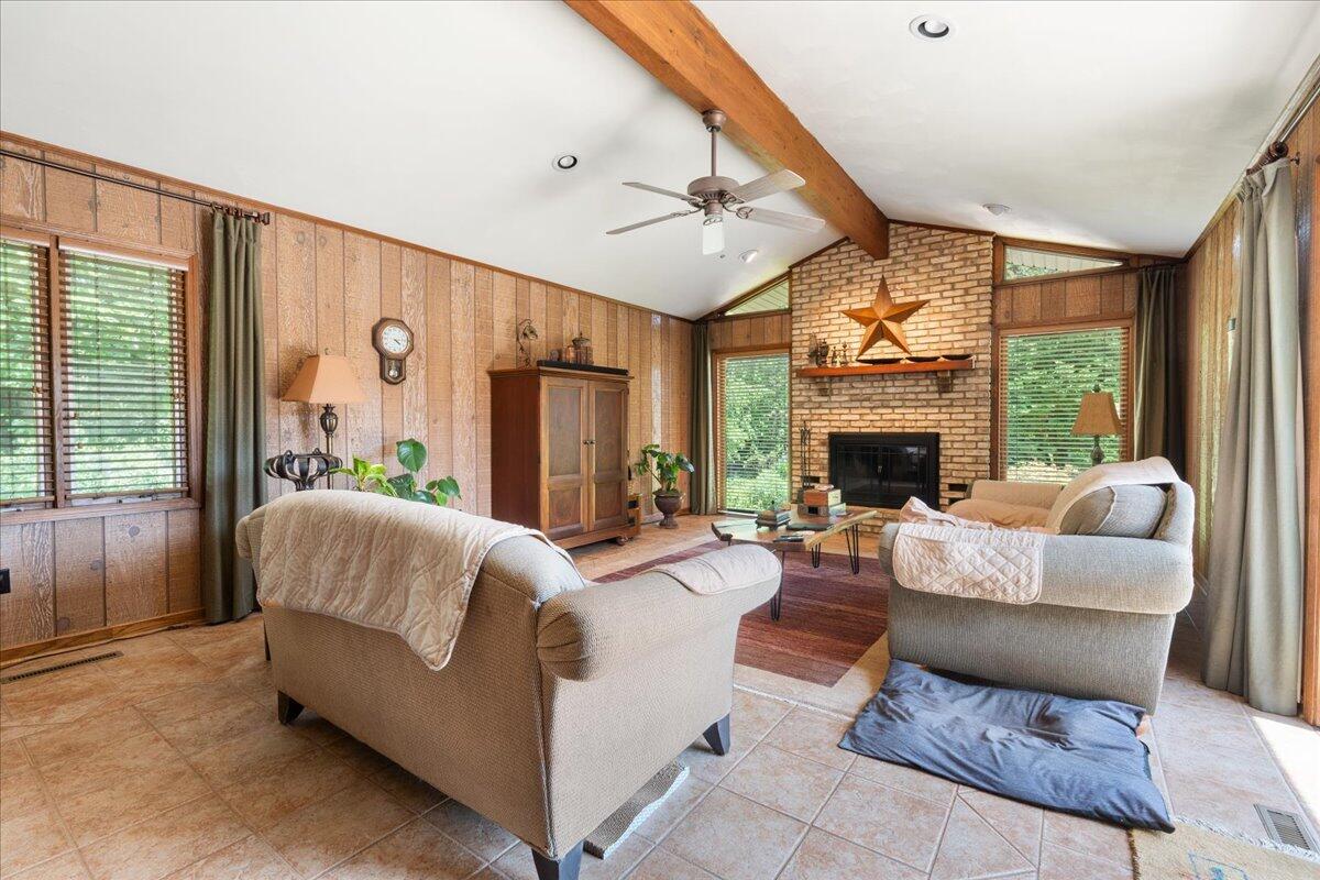 453 Wirtz Road Wirtz, VA 24184 - Photo 23 of 69 a living room with furniture large window and a fireplace