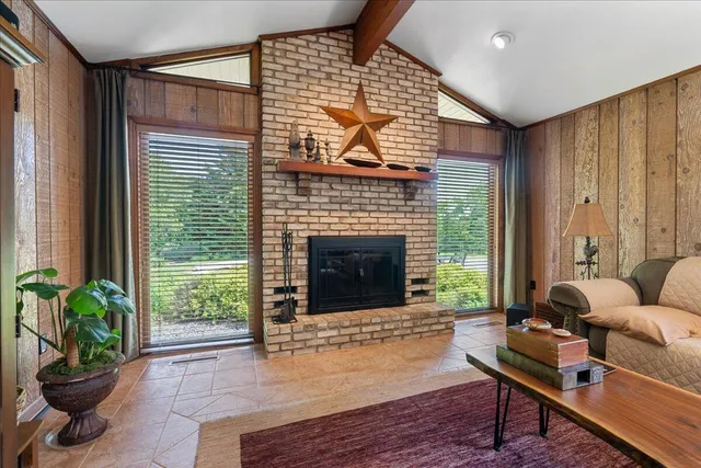 a bedroom with a bed couch and window