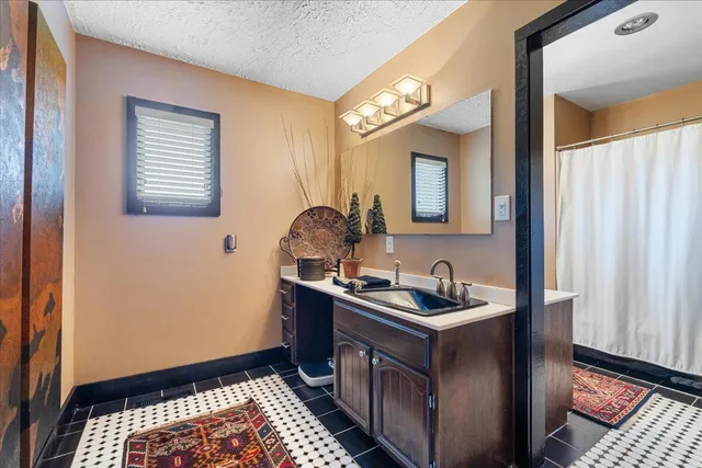 a view of a livingroom with furniture and a window