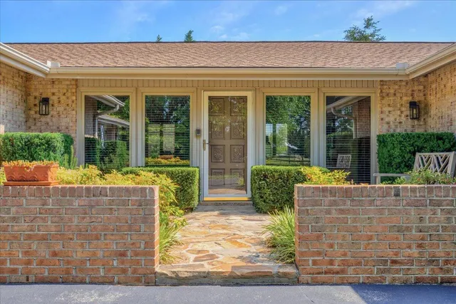 an aerial view of a house with outdoor space