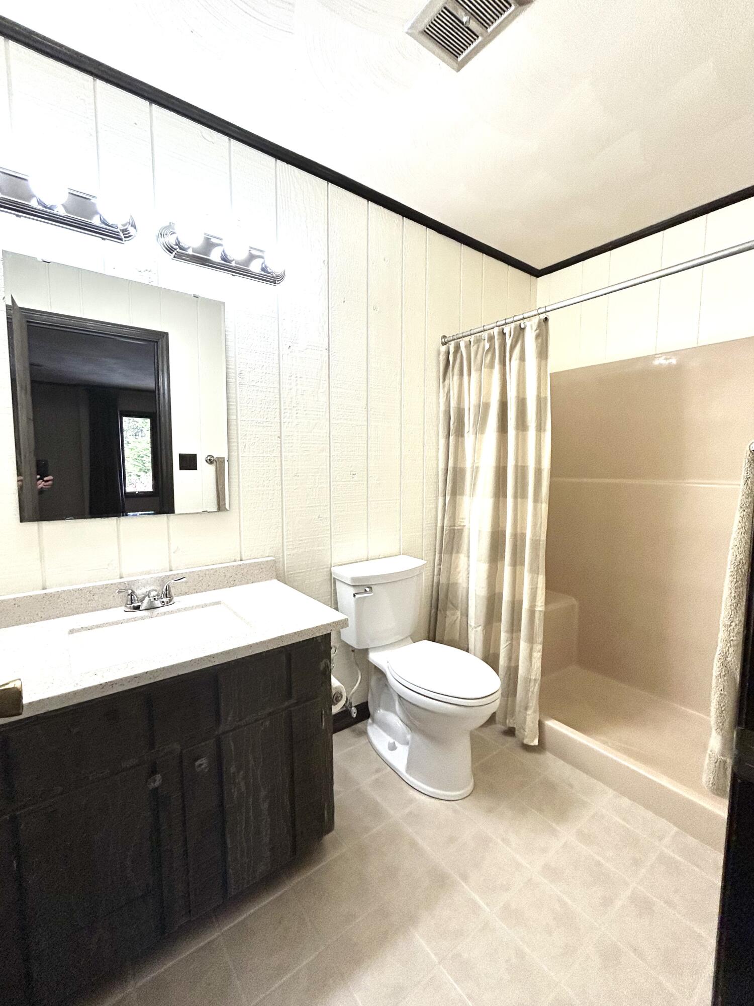 453 Wirtz Road Wirtz, VA 24184 - Photo 43 of 72 a bathroom with a double vanity sink toilet and shower
