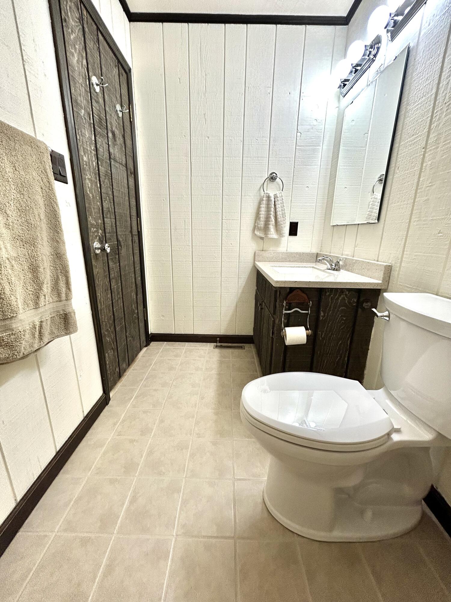453 Wirtz Road Wirtz, VA 24184 - Photo 44 of 72 a bathroom with a sink a toilet a mirror and shower