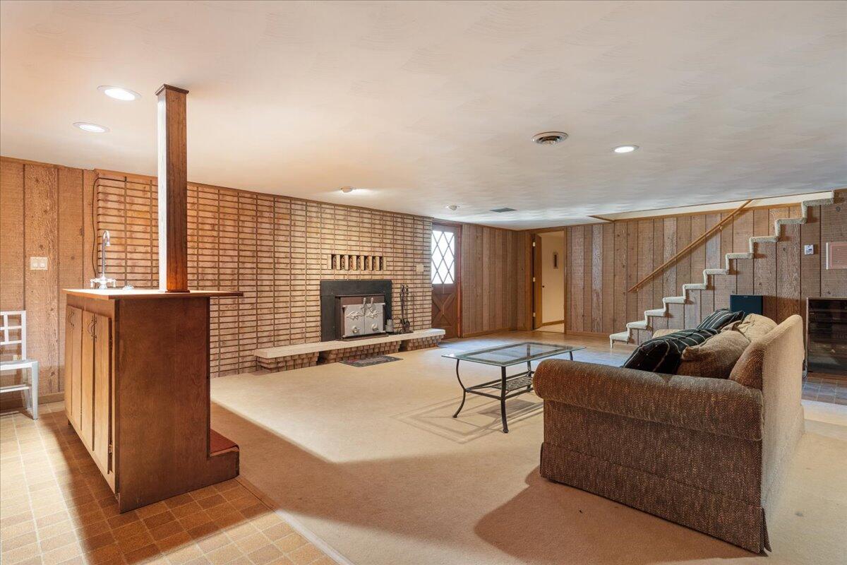 453 Wirtz Road Wirtz, VA 24184 - Photo 52 of 72 a living room with furniture a large window and a fireplace