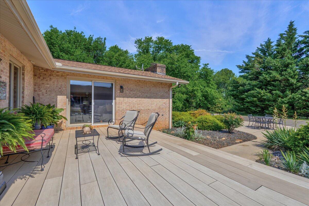 453 Wirtz Road Wirtz, VA 24184 - Photo 62 of 72 a backyard of a house with wooden floor yard and outdoor seating