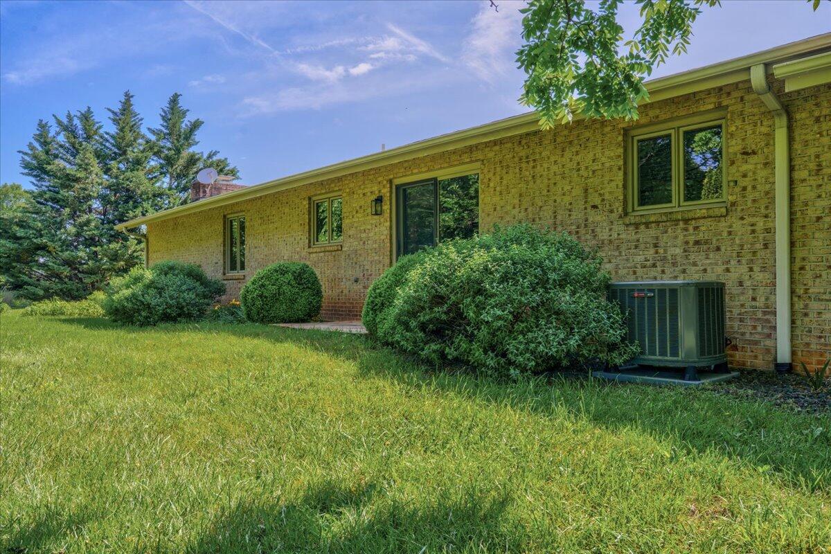 453 Wirtz Road Wirtz, VA 24184 - Photo 71 of 72 a view of a backyard with plants and large trees