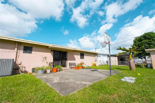 a view of a backyard with a patio
