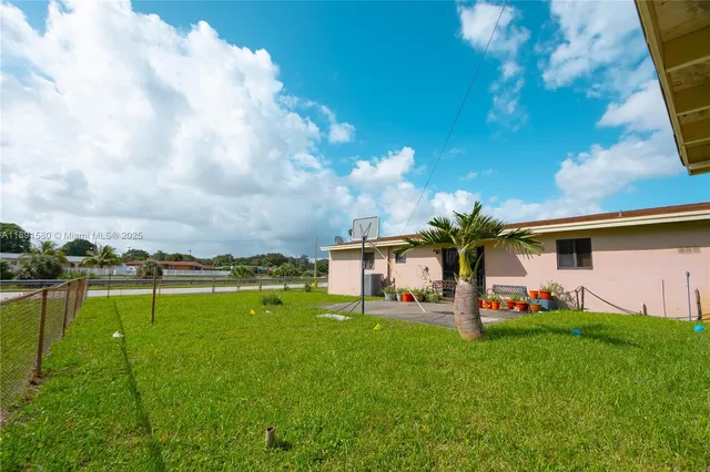 a view of a house with a big yard