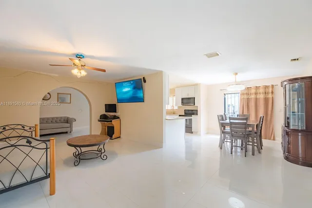 a view of a livingroom with furniture and a window