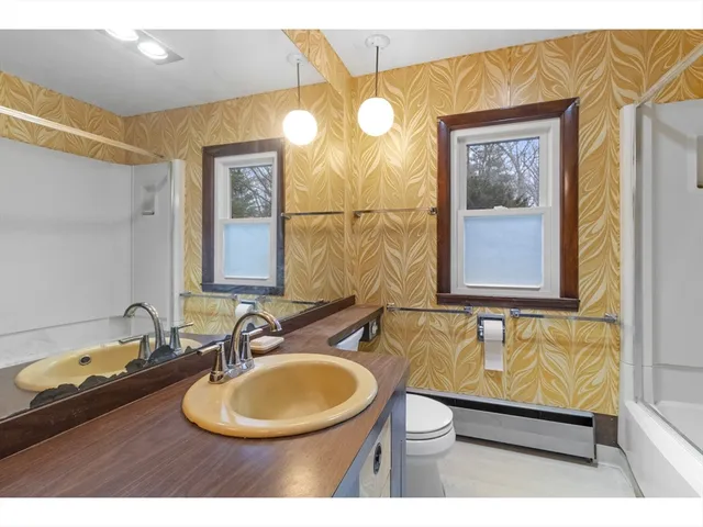 a bathroom with a bathtub and shower