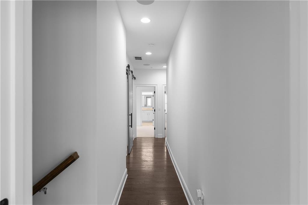 6408 Radiant Trace Atlanta, GA 30328 - Photo 20 of 40 a view of hallway with wooden floor