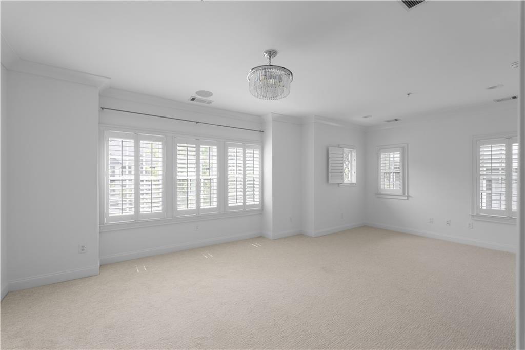 6408 Radiant Trace Atlanta, GA 30328 - Photo 21 of 40 a view of an empty room with a window