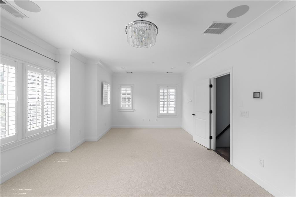 6408 Radiant Trace Atlanta, GA 30328 - Photo 22 of 40 a view of an empty room with a window