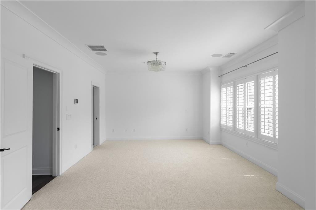 6408 Radiant Trace Atlanta, GA 30328 - Photo 23 of 40 a view of an empty room with a window