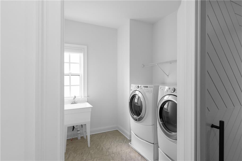 6408 Radiant Trace Atlanta, GA 30328 - Photo 26 of 40 a utility room with dryer and washer