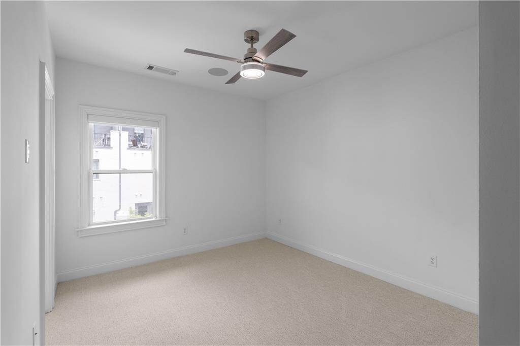 6408 Radiant Trace Atlanta, GA 30328 - Photo 27 of 40 an empty room with a window
