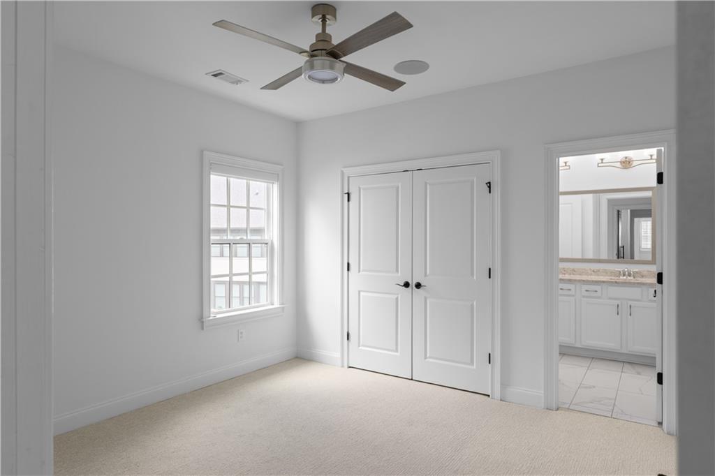 6408 Radiant Trace Atlanta, GA 30328 - Photo 28 of 40 a view of an empty room with a window