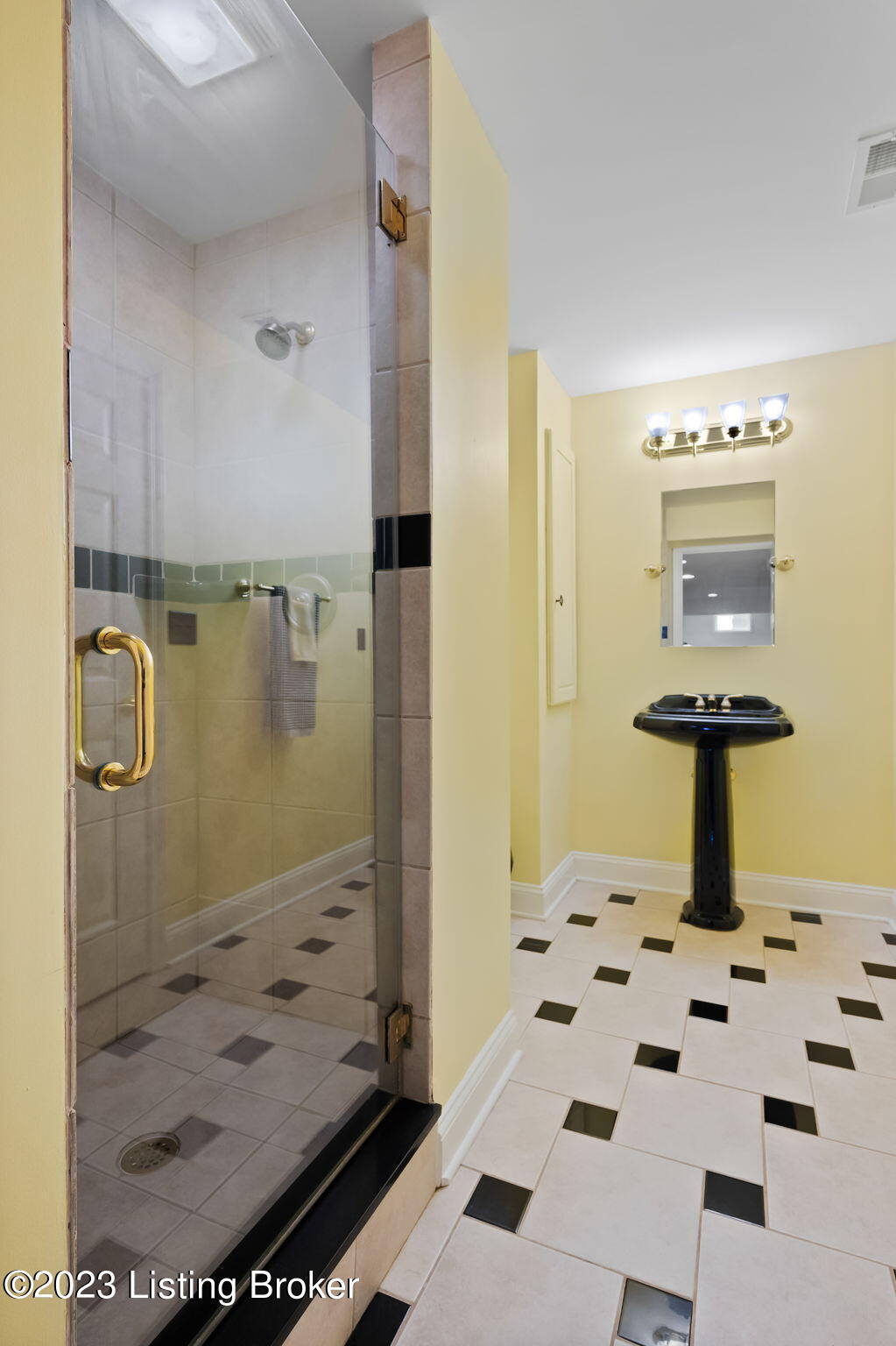4610 Stone Ridge Road Crestwood, KY 40014 - Photo 37 of 52 The full bath features classic black and white tiling, a pedestal sink, sconce lighting, a linen closet, and a walk-in shower