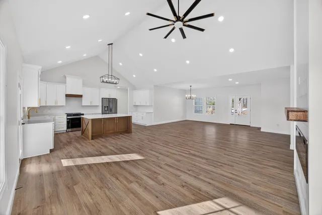 a view of kitchen with cabinets and wooden floor