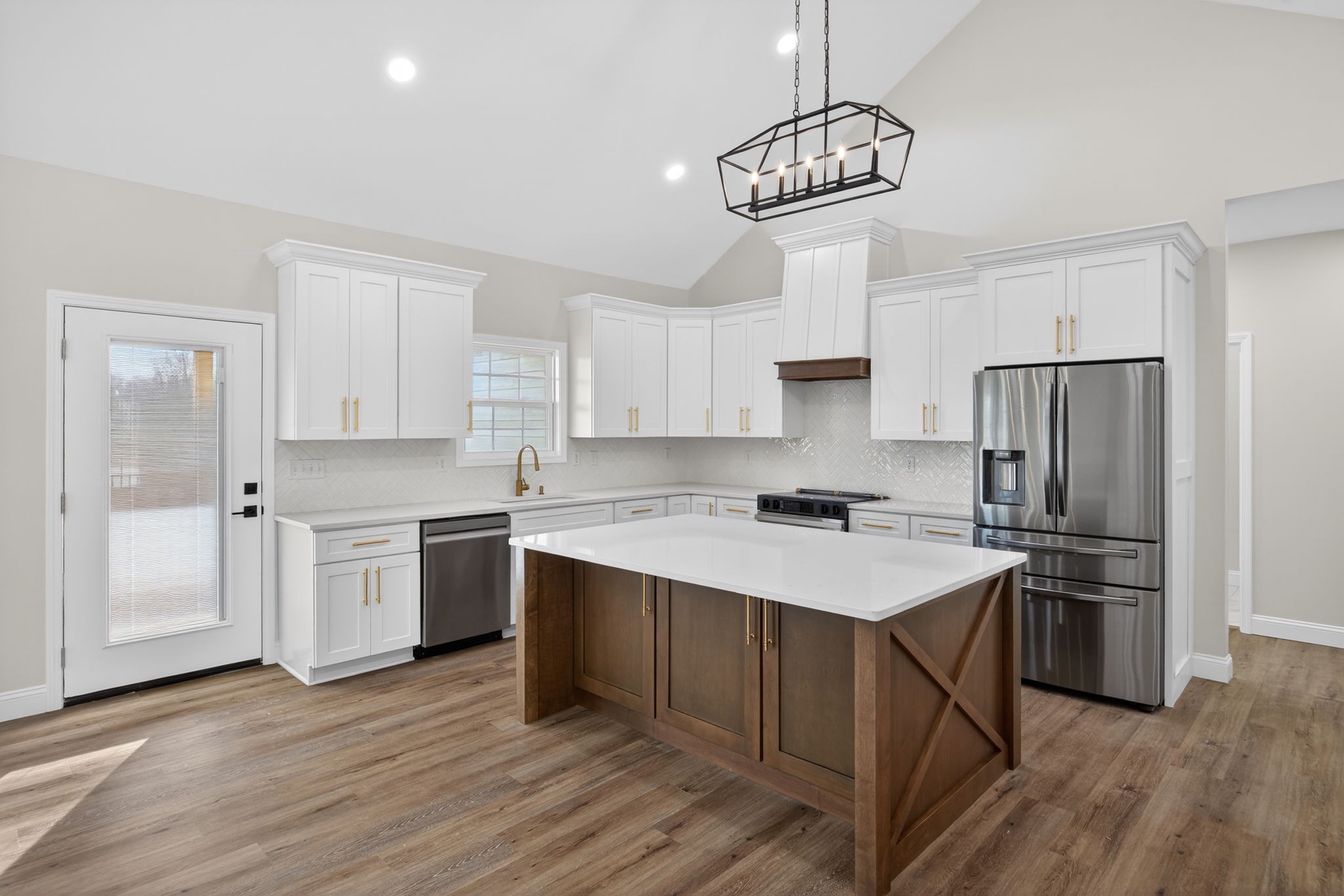 6572 Thomas Twin Oaks Road Baxter, TN 38544 - Photo 5 of 30 a kitchen with a center island white cabinets and stainless steel appliances