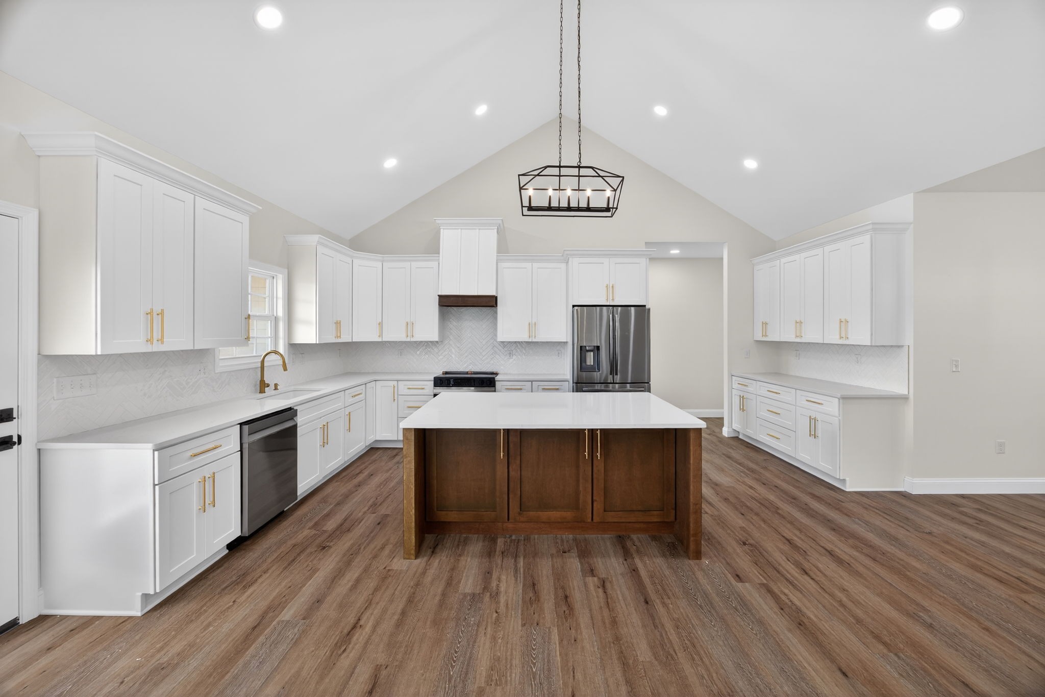 6572 Thomas Twin Oaks Road Baxter, TN 38544 - Photo 6 of 30 a large kitchen with stainless steel appliances a large center island wooden floor stainless steel appliances and cabinets