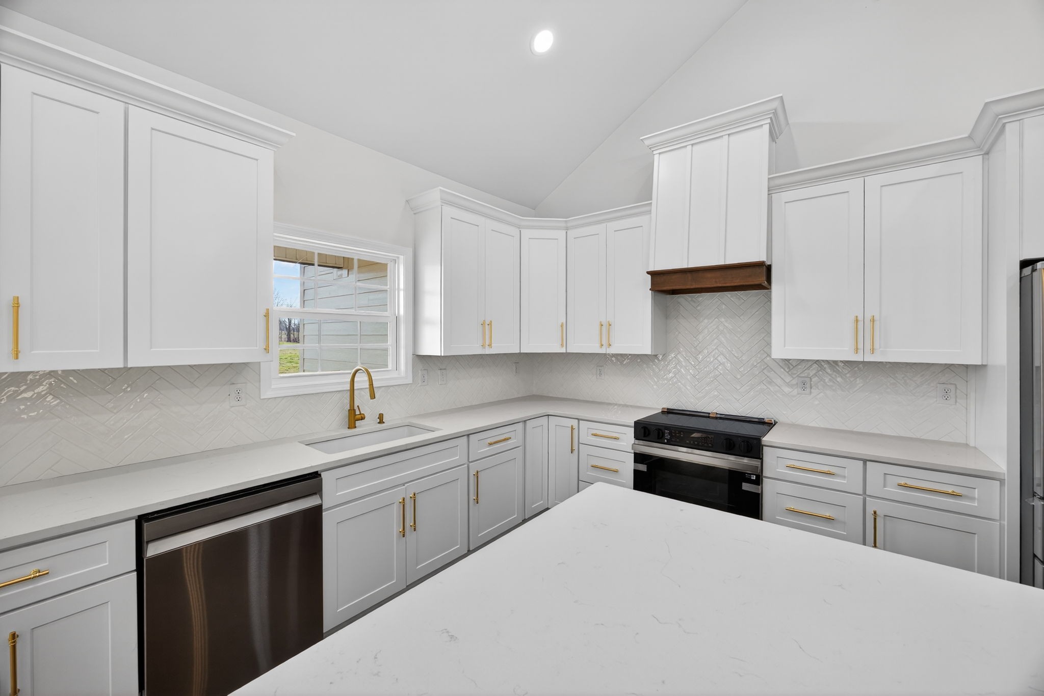 6572 Thomas Twin Oaks Road Baxter, TN 38544 - Photo 7 of 30 a kitchen with a sink stove and cabinets