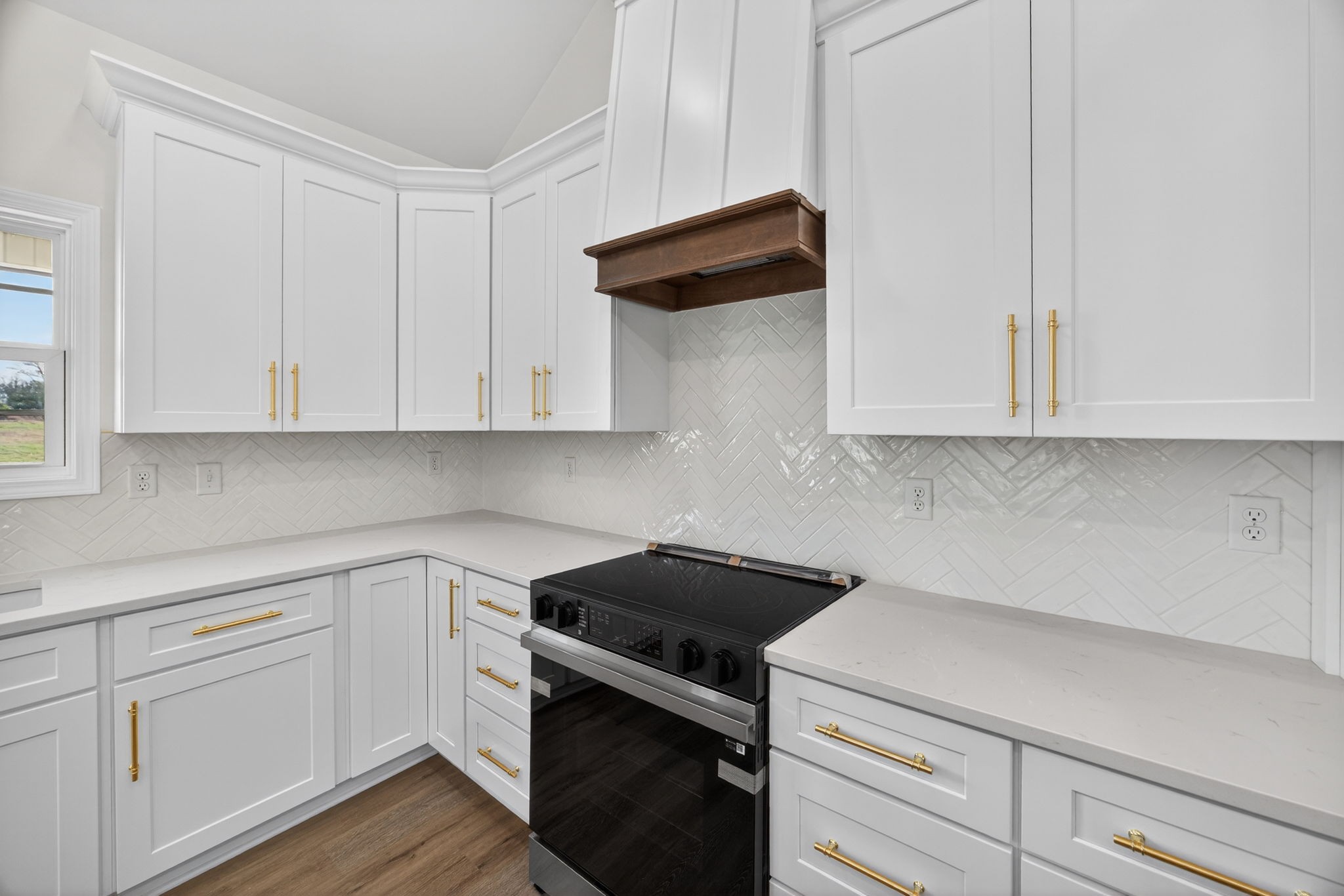 6572 Thomas Twin Oaks Road Baxter, TN 38544 - Photo 8 of 30 a kitchen with white cabinets stainless steel appliances and sink