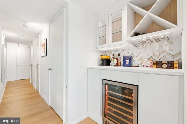 a kitchen with a stove a sink and a microwave