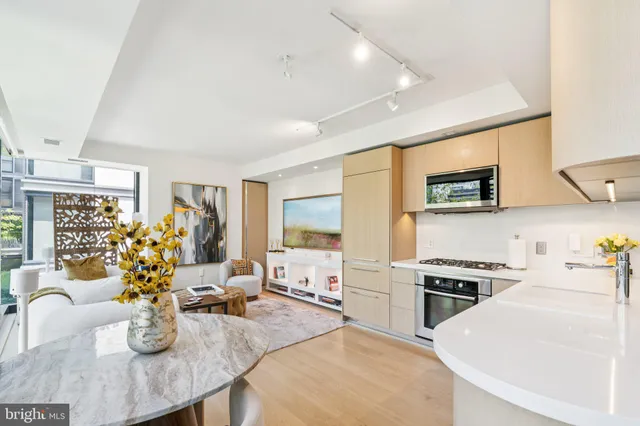 a kitchen with a stove a sink and a refrigerator