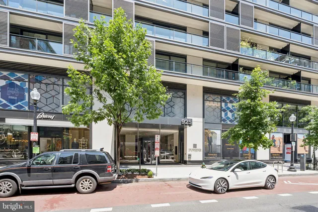 a front view of a building with a garden